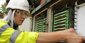 Woman working at network box